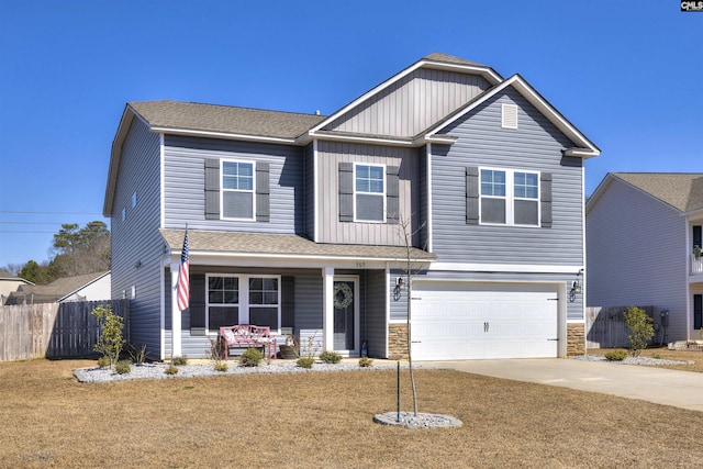 craftsman house featuring a porch, concrete driveway, board and batten siding, fence, and a garage