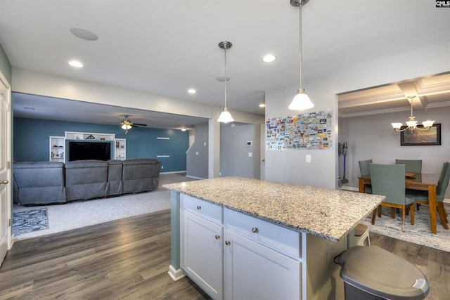 kitchen with dark wood-style floors, a center island, and recessed lighting