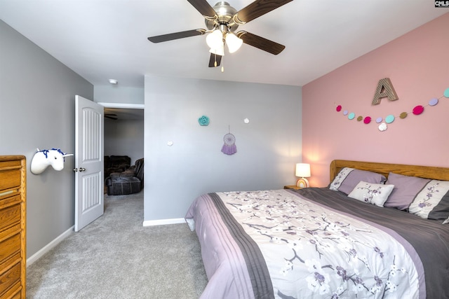 carpeted bedroom with baseboards and a ceiling fan