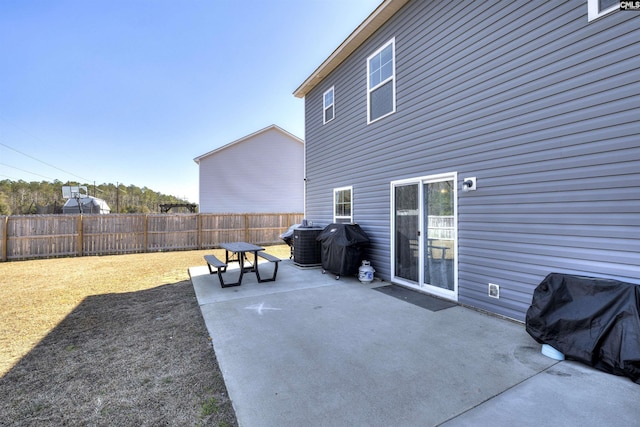 view of patio / terrace featuring fence and a grill