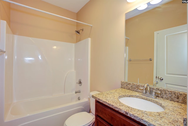 bathroom with shower / tub combination, vanity, and toilet