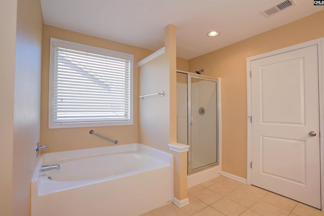 bathroom with tile patterned floors, visible vents, a shower stall, and a bath
