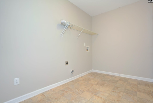 clothes washing area with laundry area, hookup for a washing machine, electric dryer hookup, and baseboards