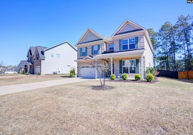 view of front of home with concrete driveway, board and batten siding, fence, a garage, and a front lawn