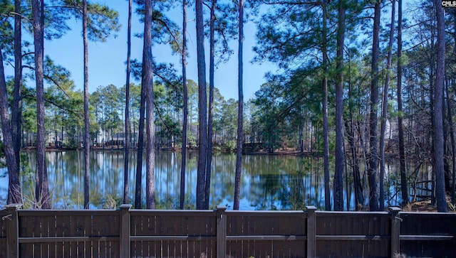 view of water feature with fence