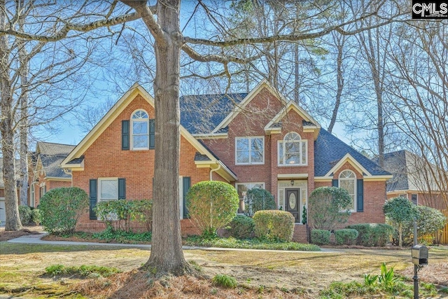 view of front of home with brick siding