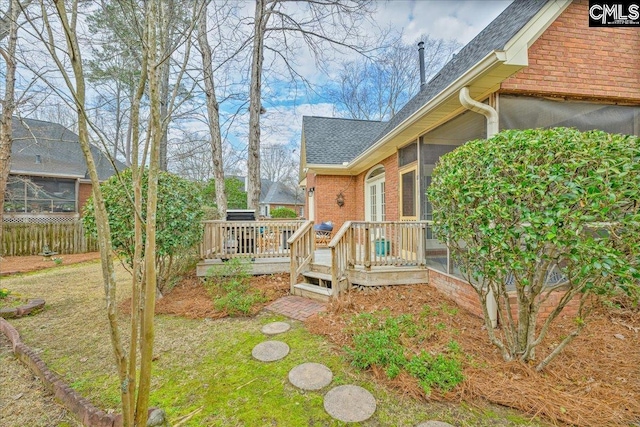 view of yard with fence and a deck