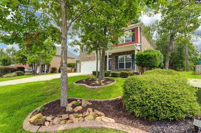 obstructed view of property featuring concrete driveway, brick siding, an attached garage, and a front yard