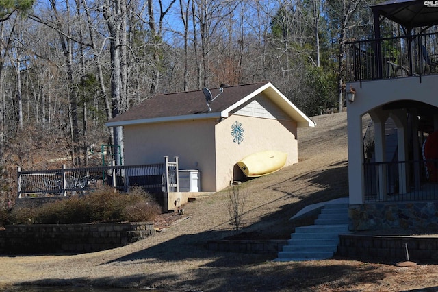 view of side of property with stucco siding