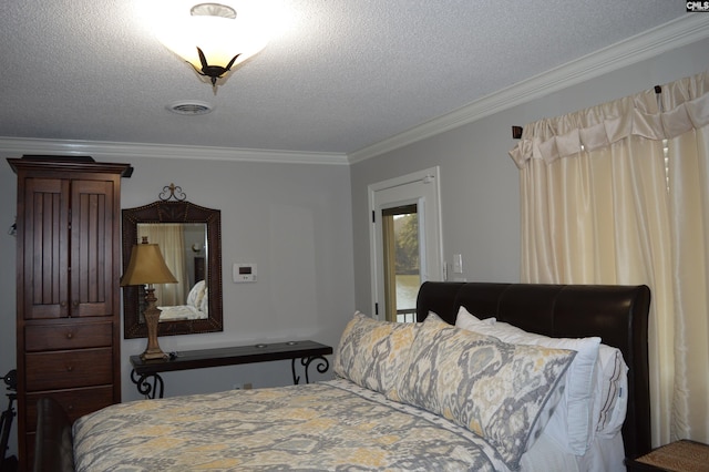 bedroom featuring visible vents, a textured ceiling, and ornamental molding