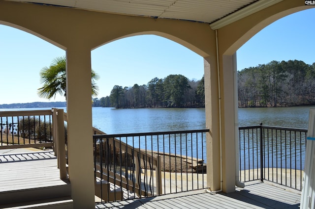 wooden deck with a water view