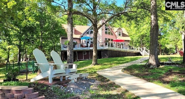 exterior space with stairway and a deck