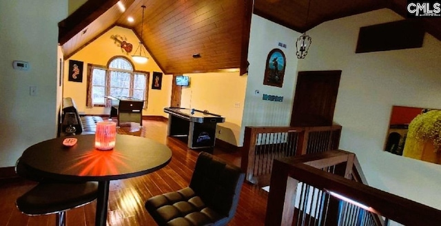 dining room with lofted ceiling, wooden ceiling, and wood finished floors