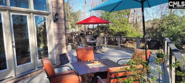 exterior space with a fire pit and outdoor dining space