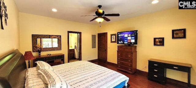 bedroom featuring dark wood finished floors, electric panel, and recessed lighting