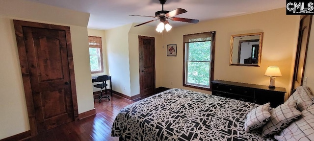 bedroom with baseboards and wood finished floors