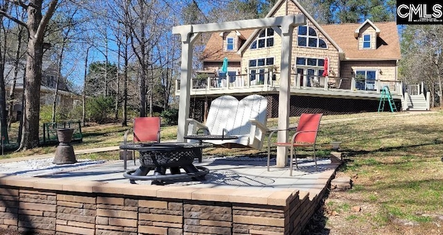 exterior space featuring a deck, a yard, stairway, and a patio area