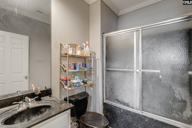 bathroom with visible vents, bath / shower combo with glass door, ornamental molding, and vanity