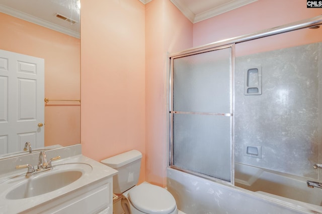 bathroom with ornamental molding, visible vents, vanity, and combined bath / shower with glass door