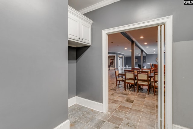 dining room with crown molding, recessed lighting, light tile patterned flooring, and baseboards