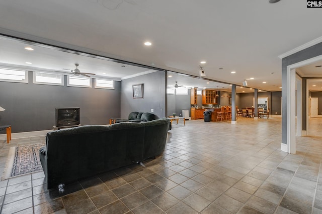 tiled living area with ceiling fan, ornamental molding, recessed lighting, and baseboards