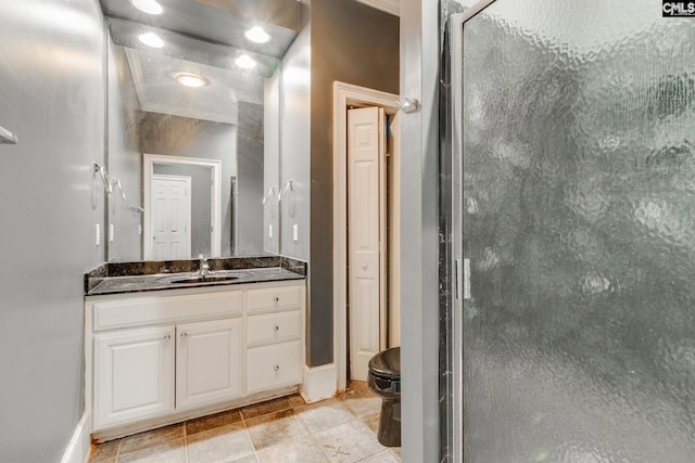 full bathroom with tile patterned floors, a shower stall, vanity, and baseboards