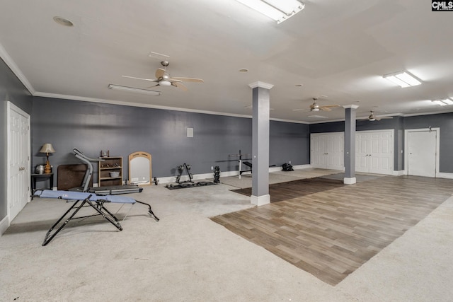 workout area featuring baseboards, ornamental molding, and a ceiling fan