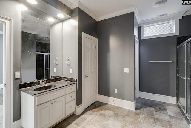 bathroom featuring a stall shower, baseboards, visible vents, crown molding, and vanity