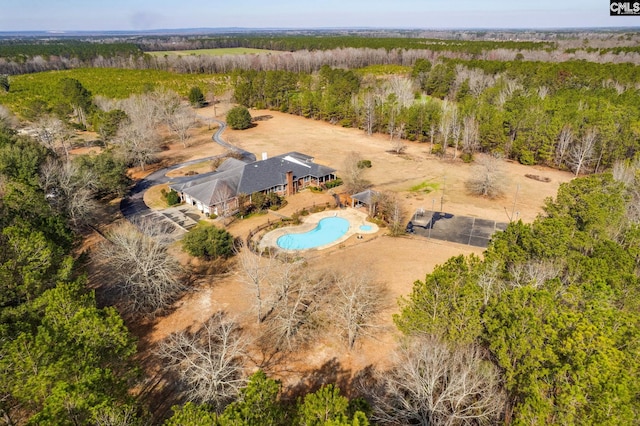 drone / aerial view with a view of trees