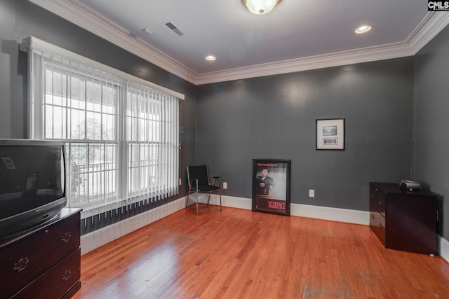 miscellaneous room featuring visible vents, crown molding, and wood finished floors