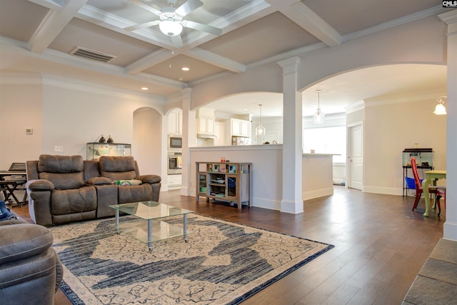 living room featuring dark wood-type flooring, coffered ceiling, beam ceiling, and visible vents