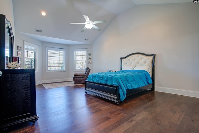 bedroom featuring baseboards, visible vents, multiple windows, and wood finished floors