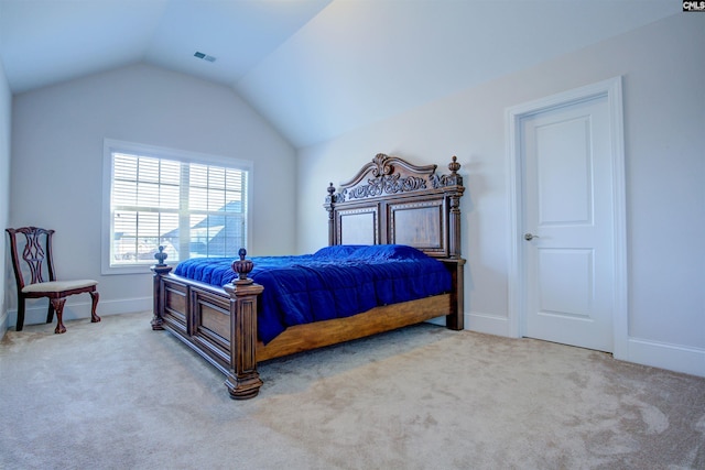 carpeted bedroom featuring lofted ceiling, visible vents, and baseboards