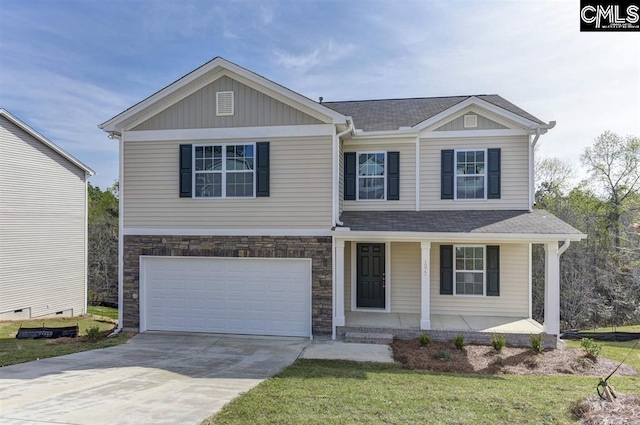 craftsman house with covered porch, concrete driveway, an attached garage, stone siding, and a front lawn