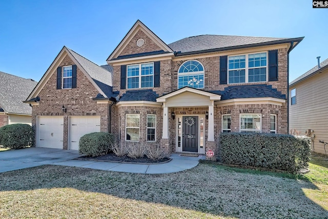 view of front of home with concrete driveway, brick siding, an attached garage, and a shingled roof