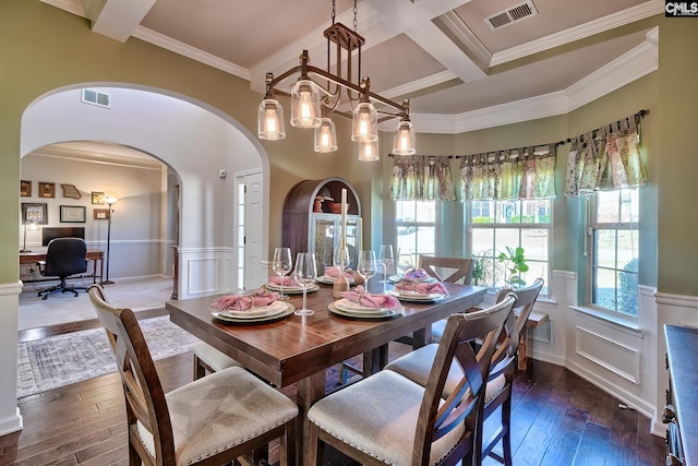 dining area featuring hardwood / wood-style floors, visible vents, coffered ceiling, and beam ceiling