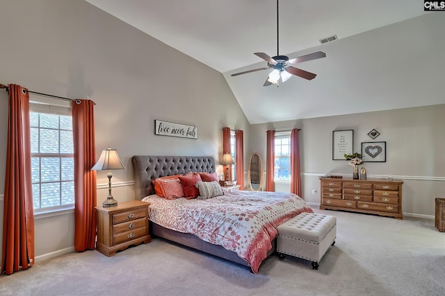 carpeted bedroom featuring baseboards, visible vents, high vaulted ceiling, and a ceiling fan