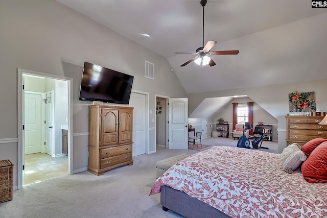 carpeted bedroom featuring high vaulted ceiling, visible vents, and a ceiling fan