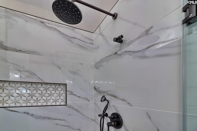 details featuring a marble finish shower