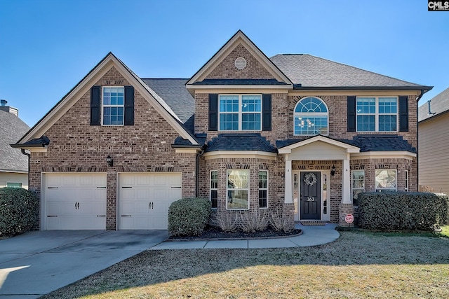 view of front of house with a garage, concrete driveway, brick siding, and roof with shingles