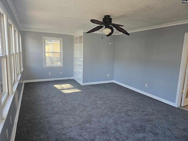 unfurnished room with a textured ceiling, ornamental molding, dark carpet, and baseboards