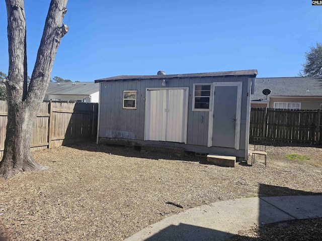 view of shed with a fenced backyard