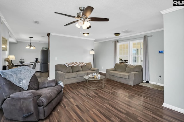 living room featuring dark wood-style floors, a textured ceiling, visible vents, and baseboards