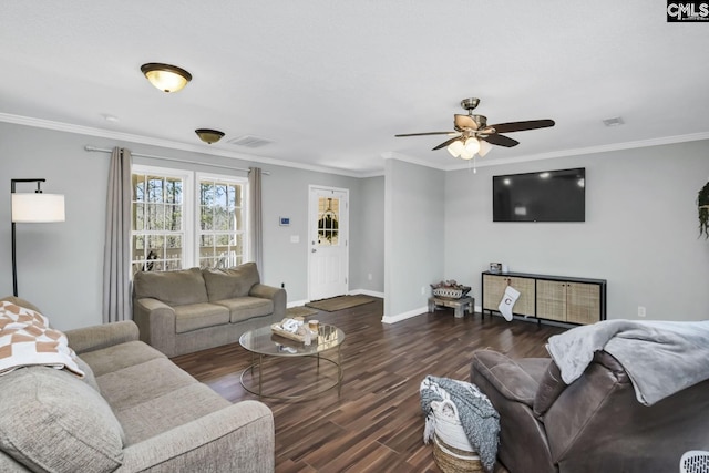 living room with visible vents, crown molding, baseboards, and wood finished floors