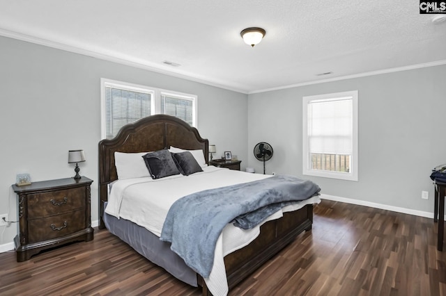 bedroom featuring dark wood-type flooring, multiple windows, and ornamental molding