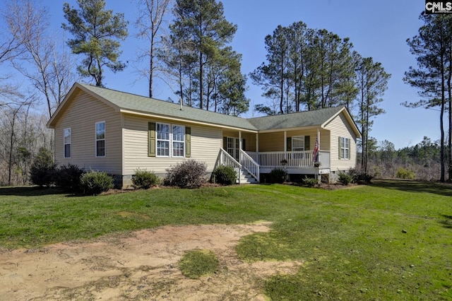 single story home with covered porch and a front lawn