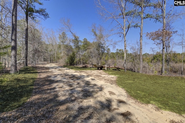 view of street with a wooded view