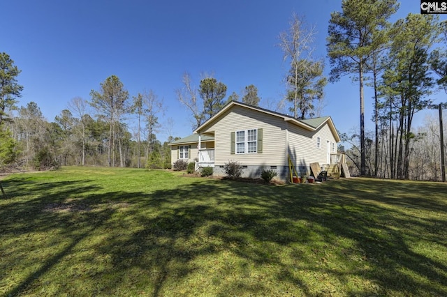 view of side of property featuring crawl space and a yard