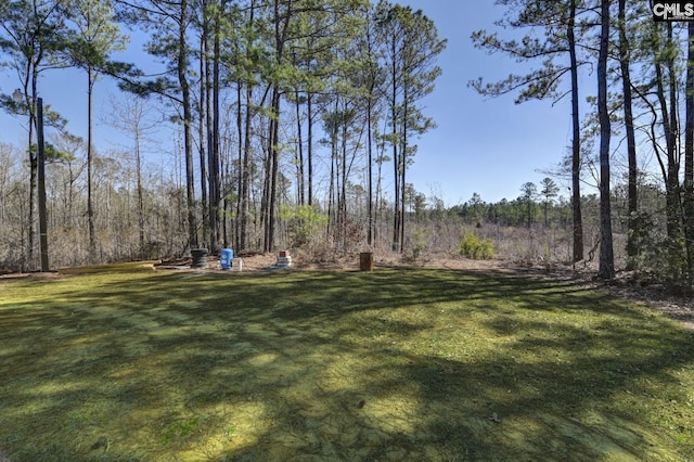 view of yard featuring a view of trees