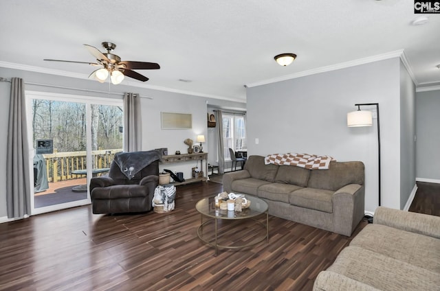 living room featuring crown molding, wood finished floors, a ceiling fan, and baseboards